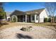 Picture of backyard with stone fire pit and room for entertaining at 260 Barclay Dr., Myrtle Beach, SC 29579
