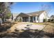 Charming backyard with a fire pit area, surrounded by a well-maintained lawn at 260 Barclay Dr., Myrtle Beach, SC 29579