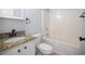 Neutral bathroom with granite countertop, updated fixtures, and a tub shower combo at 260 Barclay Dr., Myrtle Beach, SC 29579