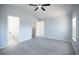 Bright bedroom with vaulted ceiling, gray floors, and a walk-in closet at 260 Barclay Dr., Myrtle Beach, SC 29579