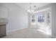 Bright dining area with a chandelier and large windows overlooking the backyard at 260 Barclay Dr., Myrtle Beach, SC 29579