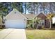Charming single-story home featuring a two-car garage and a mix of siding and brick facade at 260 Barclay Dr., Myrtle Beach, SC 29579