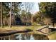 Beautiful golf course view with serene water feature and lush greenery, perfect for relaxation at 260 Barclay Dr., Myrtle Beach, SC 29579
