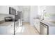 Modern kitchen features white cabinets, stainless steel appliances, and stone countertops at 260 Barclay Dr., Myrtle Beach, SC 29579