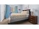 Inviting bedroom with balcony access, comfortable bed, wooden nightstand, and nautical wall art at 3401 N Ocean Blvd. # 109, North Myrtle Beach, SC 29582
