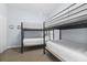 Cozy bedroom featuring bunkbeds, carpeted floor, and soft, calming paint at 3401 N Ocean Blvd. # 109, North Myrtle Beach, SC 29582