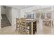 Open-concept dining area with large table and chairs, seamlessly connected to living space at 3401 N Ocean Blvd. # 109, North Myrtle Beach, SC 29582