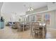 Bright dining area with ample seating and tile floors, adjacent to the cozy living room at 3401 N Ocean Blvd. # 109, North Myrtle Beach, SC 29582