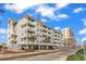 Beautiful exterior view of the condo building showcasing the various balconies and its proximity to the beach at 3401 N Ocean Blvd. # 109, North Myrtle Beach, SC 29582