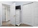 Hallway features a chest of drawers with TV, and has doors for closet and bedrooms at 3401 N Ocean Blvd. # 109, North Myrtle Beach, SC 29582