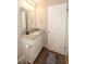 This bathroom includes a granite vanity, white cabinets, and modern fixtures at 3491 Alexandria Ave., Myrtle Beach, SC 29577