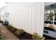 Side exterior of a home with white siding and manicured landscaping at 3491 Alexandria Ave., Myrtle Beach, SC 29577
