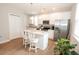 Modern kitchen with white cabinets, granite countertops, stainless steel appliances, and center island with seating at 3491 Alexandria Ave., Myrtle Beach, SC 29577