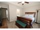 Main bedroom with a view into bathroom featuring a tray ceiling and neutral decor at 3491 Alexandria Ave., Myrtle Beach, SC 29577