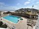 Large pool with hot tub with beach and ocean views with lounge chairs nearby at 3601 N Ocean Blvd. # 1140, North Myrtle Beach, SC 29582