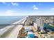 Breathtaking aerial view of the beach, pier, and cityscape, showcasing condo building's prime coastal location at 3601 N Ocean Blvd. # 1840, North Myrtle Beach, SC 29582