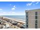 Scenic view from condo balcony, showcasing the beachfront, nearby pier, and the ocean's horizon at 3601 N Ocean Blvd. # 1840, North Myrtle Beach, SC 29582