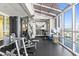 Well-equipped gym featuring weight machines, mirrored wall, towel service, and stunning city views from floor to ceiling windows at 3601 N Ocean Blvd. # 1840, North Myrtle Beach, SC 29582
