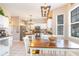 Bright kitchen with white cabinets, stainless steel appliances, and breakfast table at 364 Blackberry Ln., Myrtle Beach, SC 29579