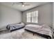 Neutral bedroom featuring two twin beds and a ceiling fan for added comfort at 4225 Rivergate Ln., Little River, SC 29566
