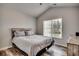 Cozy bedroom featuring vaulted ceilings, wood floors, a comfortable bed, and a bright window at 4225 Rivergate Ln., Little River, SC 29566