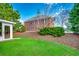 Brick building seen from a green lawn with landscaping features at 4225 Rivergate Ln., Little River, SC 29566