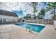 Outdoor swimming pool enclosed by wood fences with surrounding pool furniture at 4225 Rivergate Ln., Little River, SC 29566