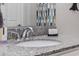 Close up of a bathroom vanity featuring a granite countertop and modern faucet at 4506 W Harbour Ct. # U2, Little River, SC 29566