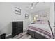 Cozy bedroom featuring a ceiling fan, wood-look flooring, and comfortable furnishings at 4506 W Harbour Ct. # U2, Little River, SC 29566
