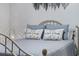 Close up of a cozy bed with decorative pillows and a metal frame at 4506 W Harbour Ct. # U2, Little River, SC 29566