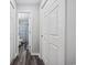Hallway with storage featuring multiple white panel doors and a view into a bathroom at 4506 W Harbour Ct. # U2, Little River, SC 29566
