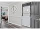 Hallway featuring a stacked washer and dryer unit and a decorative clock at 4506 W Harbour Ct. # U2, Little River, SC 29566