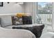 Cozy living room featuring a comfortable sectional sofa with stylish throw pillows and balcony access at 4506 W Harbour Ct. # U2, Little River, SC 29566