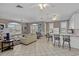 Open-concept living room with tile flooring, comfortable seating, and a breakfast bar at 4506 W Harbour Ct. # U2, Little River, SC 29566
