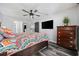 Well-lit main bedroom featuring stylish decor, wood-look flooring, and ample closet space at 4506 W Harbour Ct. # U2, Little River, SC 29566