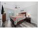 Main bedroom featuring a large bed, balcony access, and stylish decor at 4506 W Harbour Ct. # U2, Little River, SC 29566