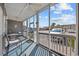 Enclosed porch featuring seating and views of the parking area at 4506 W Harbour Ct. # U2, Little River, SC 29566