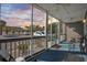 Relaxing screened porch with ceiling fan and furniture offers a comfortable outdoor living space at 4506 W Harbour Ct. # U2, Little River, SC 29566