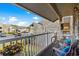 Relaxing balcony with seating, flowers, and beautiful community views at 4709 Cobblestone Dr. # F5, Myrtle Beach, SC 29577