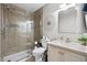 Bright bathroom with shower, decorative mirror, modern vanity, and neutral tones at 4709 Cobblestone Dr. # F5, Myrtle Beach, SC 29577