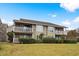 Beautiful condo featuring a brick facade, green trim, and well-maintained landscaping at 4709 Cobblestone Dr. # F5, Myrtle Beach, SC 29577