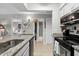 Bright kitchen featuring granite countertops, stainless steel appliances, and functional design at 4709 Cobblestone Dr. # F5, Myrtle Beach, SC 29577