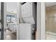 Convenient laundry closet featuring a stacked washer and dryer unit at 4709 Cobblestone Dr. # F5, Myrtle Beach, SC 29577