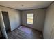 Cozy bedroom featuring wood flooring, a window for natural light, and neutral wall paint at 491 N Green Sea Rd., Loris, SC 29569