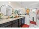 Modern bathroom showcasing double sinks, granite countertops, decorative mirrors and modern lighting at 516 S 8Th Ave.S, Surfside Beach, SC 29575