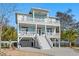 Charming two-story coastal home with multiple balconies and outdoor living spaces at 516 S 8Th Ave.S, Surfside Beach, SC 29575