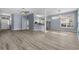Spacious living area with wood floors, an open layout, and seamless flow to the kitchen and dining spaces at 5215 Southern Trail, Myrtle Beach, SC 29579