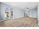 Expansive living room with modern flooring, abundant natural light, and seamless transition to outdoor living at 5215 Southern Trail, Myrtle Beach, SC 29579