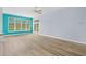 Bright living room with wood floors, a neutral color scheme, and access to the backyard through sliding glass doors at 5215 Southern Trail, Myrtle Beach, SC 29579