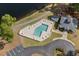 Aerial view of a community pool, surrounded by seating and landscaping at 5215 Southern Trail, Myrtle Beach, SC 29579